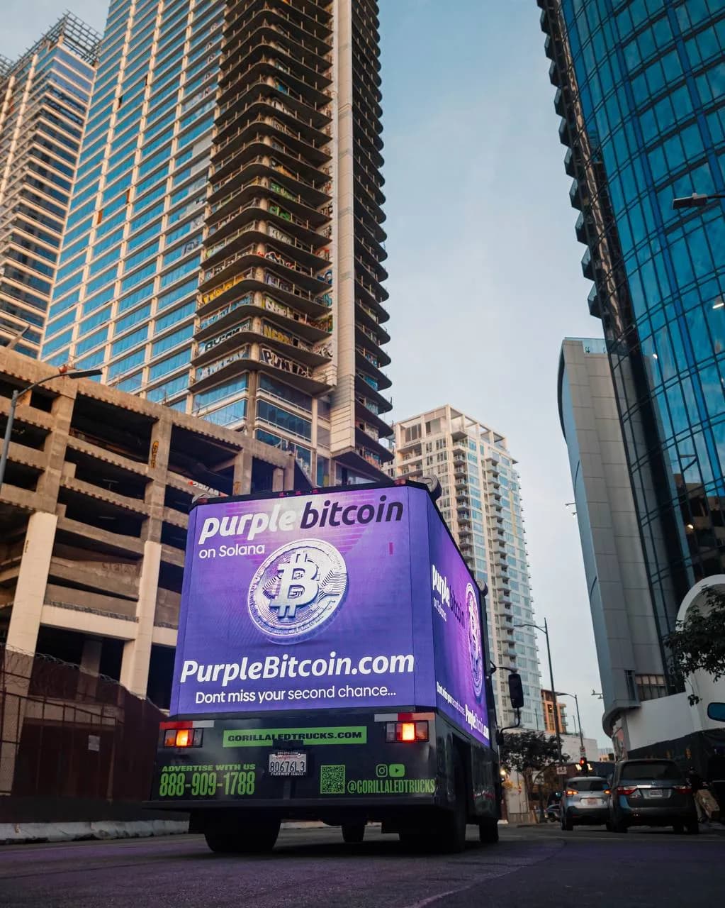 Purple Bitcoin guerrilla marketing truck activation